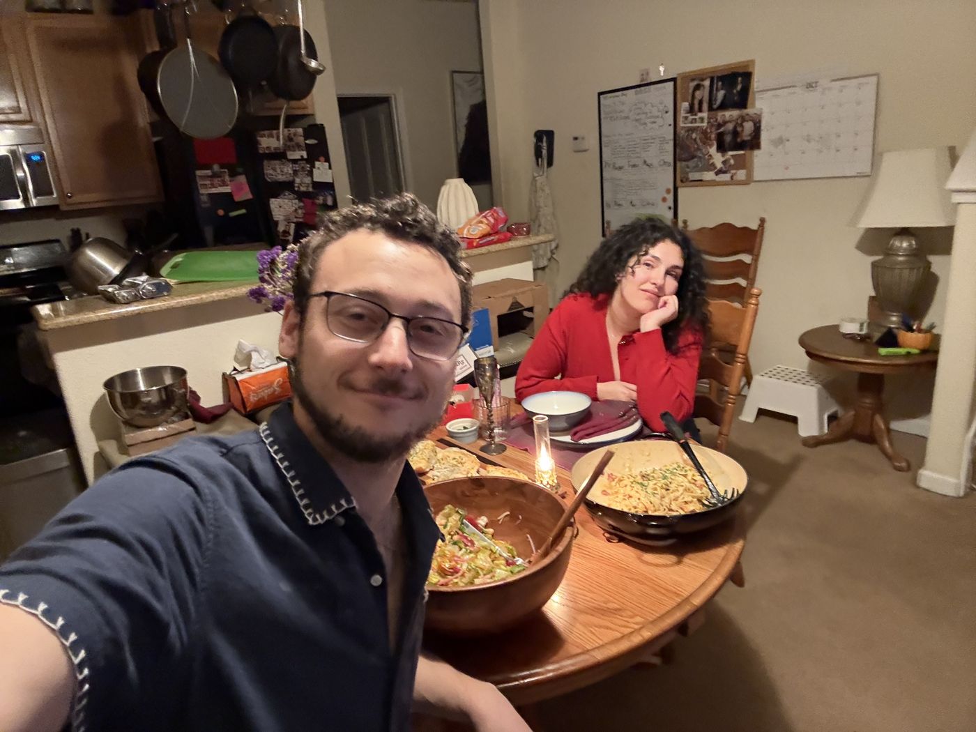 Tristan and Ileana at home with dinner on the table