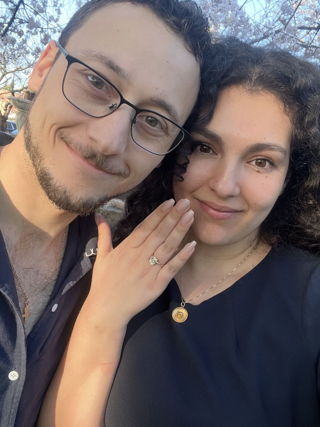 Ileana showing her engagement ring next to Tristan